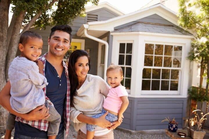 Young Family Outside a Home