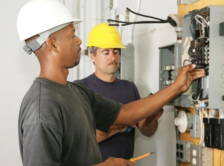 Two Contractors at an Electrical Panel